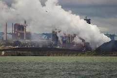 Stelco industrial buildings and white plumes viewed across water in Hamilton in an August 2006 archive photograph.