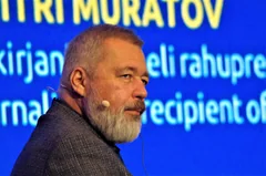 Dmitry Muratov wearing a headset microphone in Tallinn in a February 2023 archive photograph.
