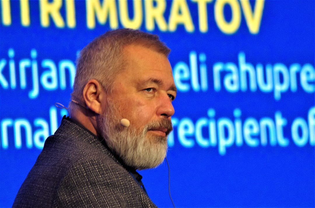Dmitry Muratov wearing a headset microphone in Tallinn in a February 2023 archive photograph.