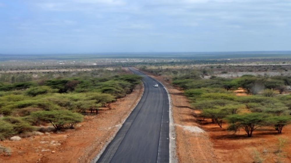 A paved road crosses open countryside on the route towards Moyale in a 2015 archive photograph.